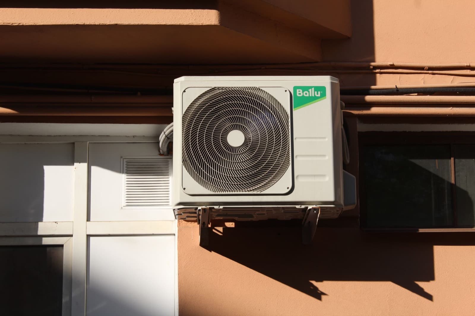 Outdoor heat pump unit installed at a suburban home