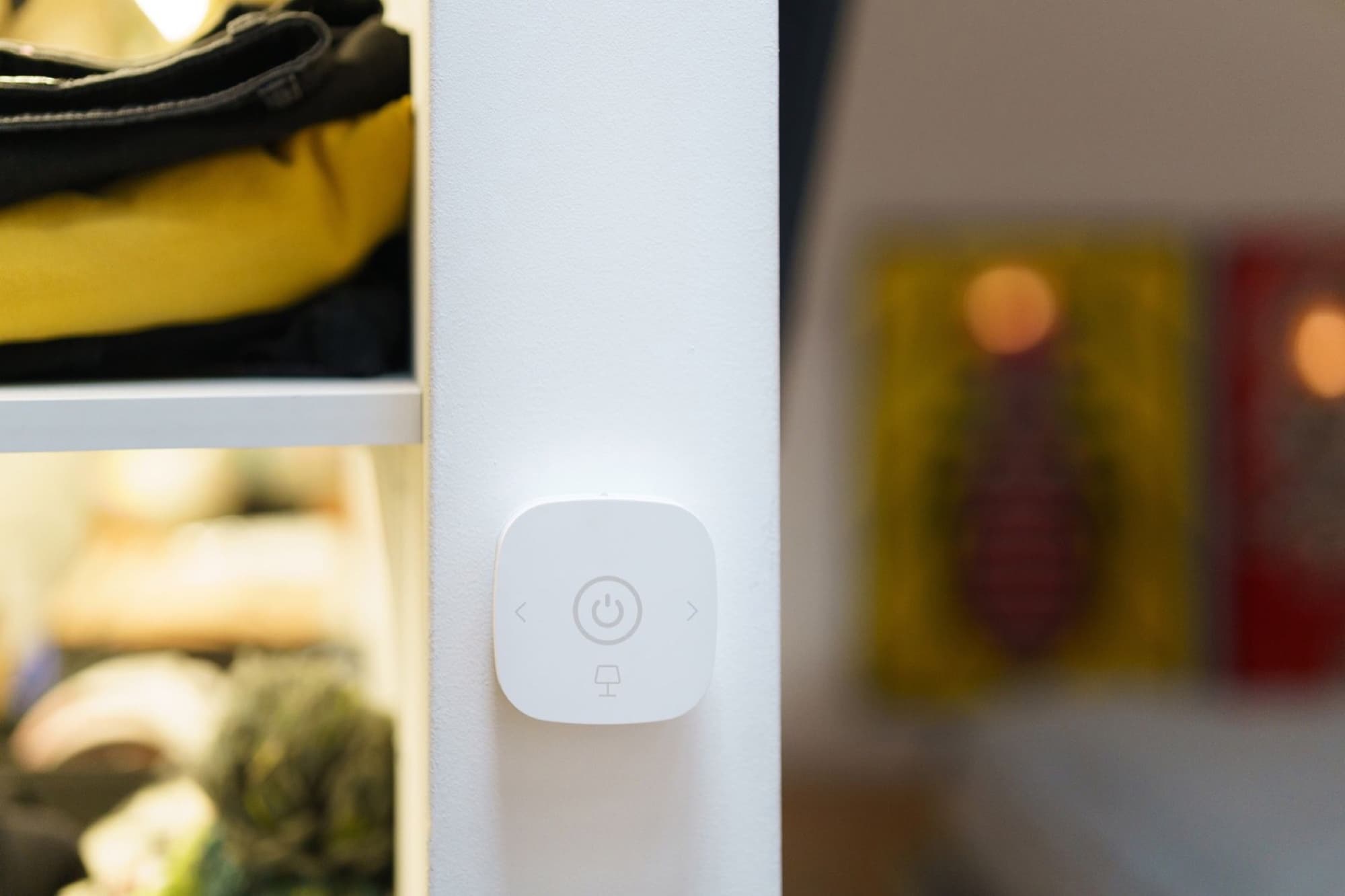 Wall-mounted smart thermostat controlling home heating and cooling